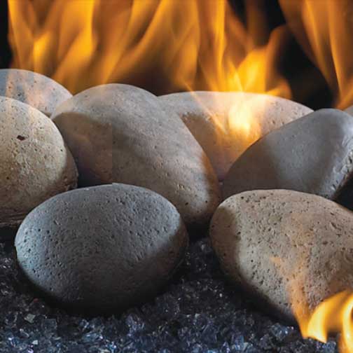 Beautiful River Rocks in your fire place with flames.
