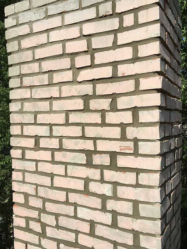 Brand new chimney rebuild brick is a peachy color.