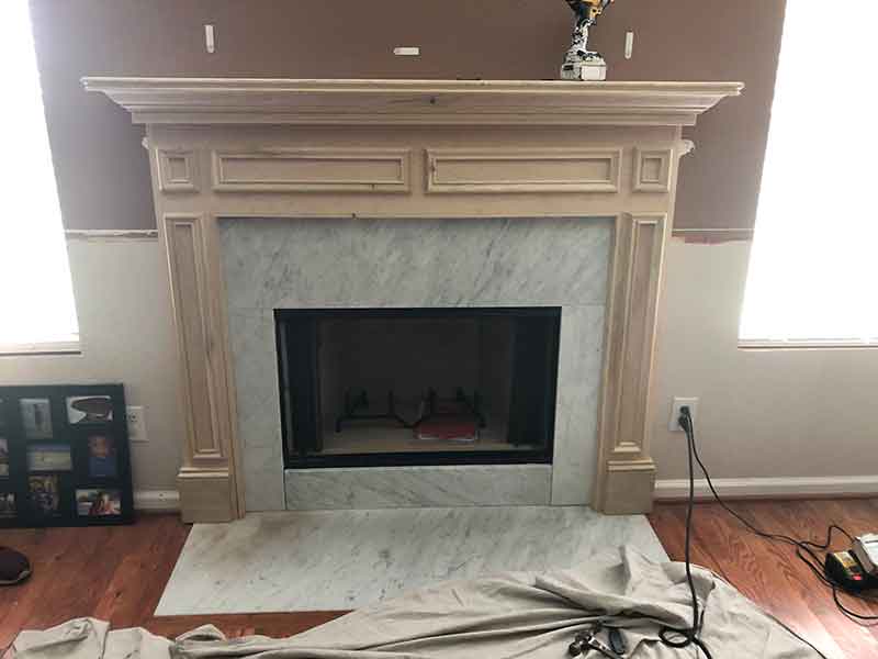 Fireplace after remodel with a new mantel.