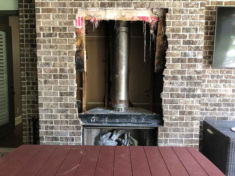 Damaged fireplaces can be repaired - tear-out tv to the right and table in the front.