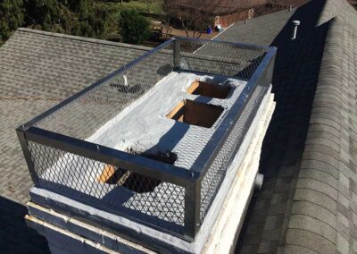 In the process of waterproofing this chimney. The cap is removed during this process. This chimney has three tile flues.