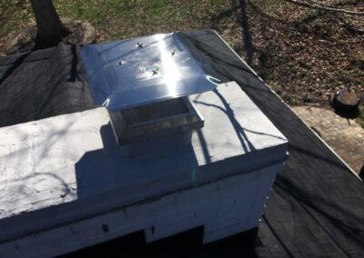 New stainless steel chimney cap and waterproofing.