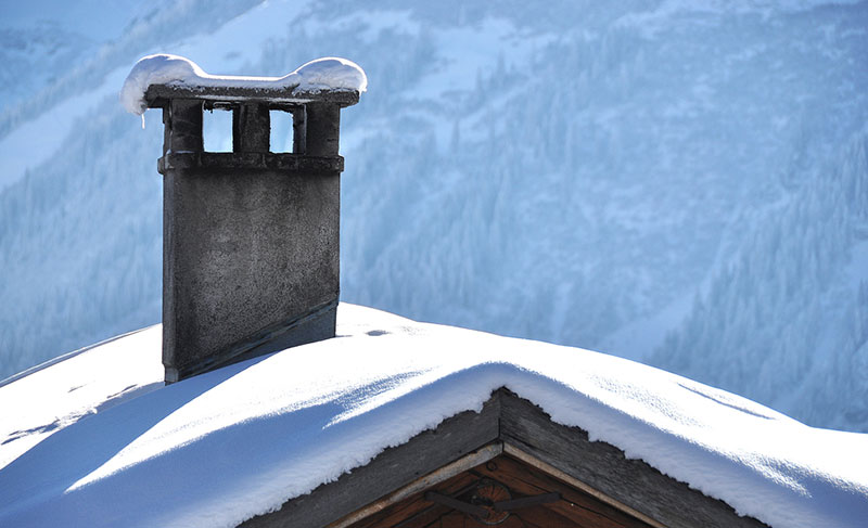 Snow on roof and chimney