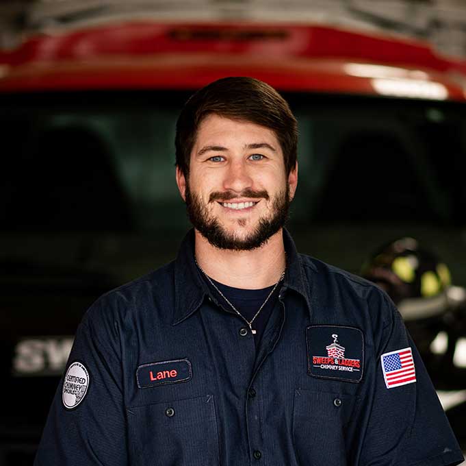 Original photo of Lane Cunningham - Sweeps and Ladders Lane Cunningham Lead Service Tech dark hair beard blue eyes