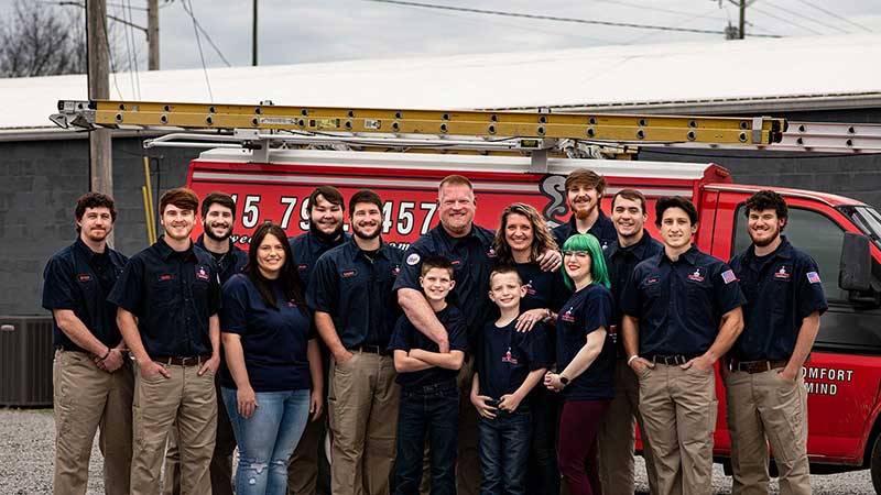 Original photo of Sweeps and Ladders team in front of truck Sweeps and Ladders team standing in front of a truck